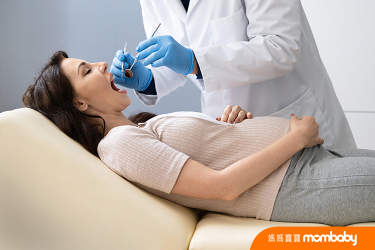 Dentist,Treating,Teeth,Of,Young,Pregnant,Woman,Patient,Lying,In